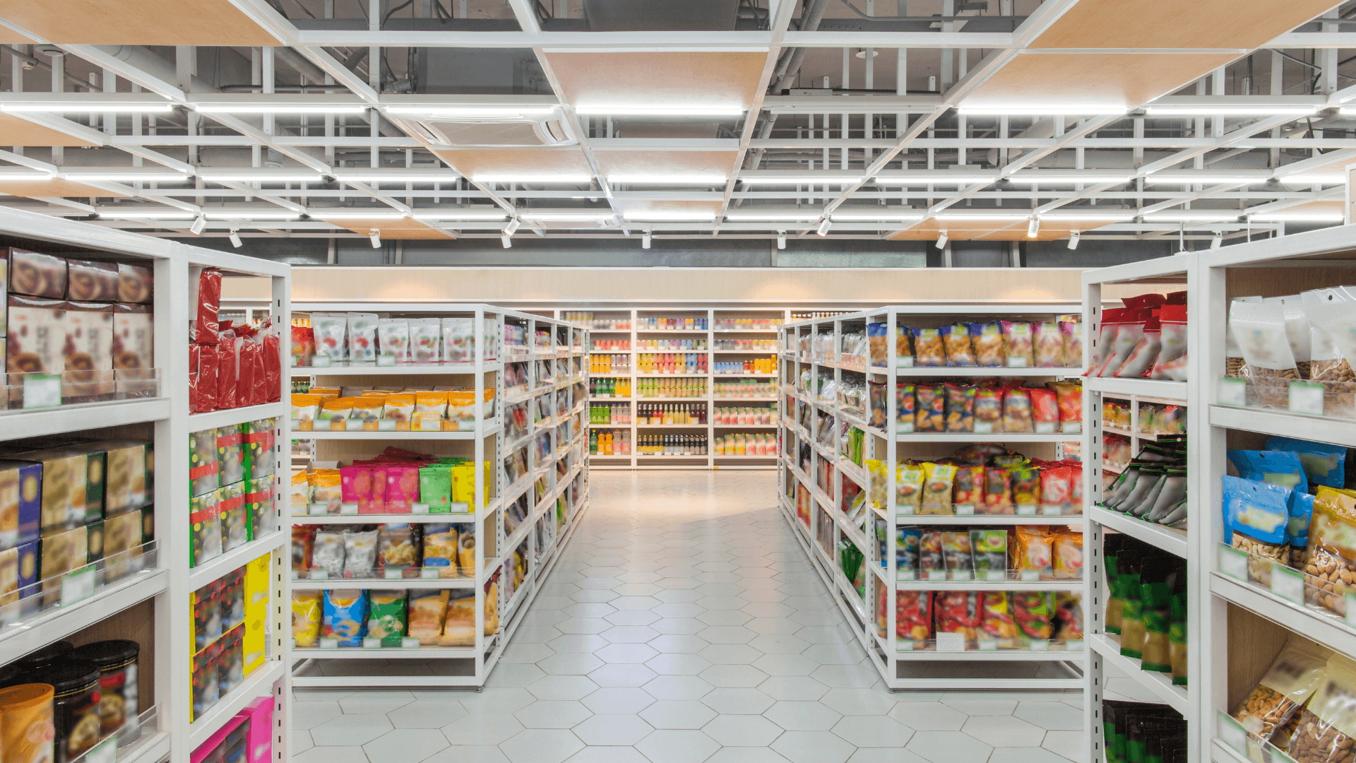 Organised supermarket aisles stocked with packaged grocery products