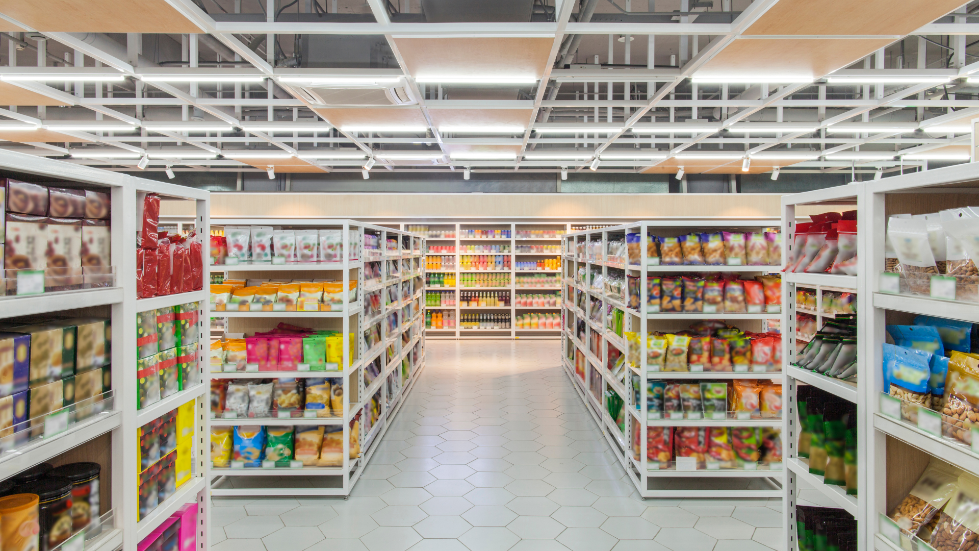 Organised supermarket aisles stocked with packaged grocery products